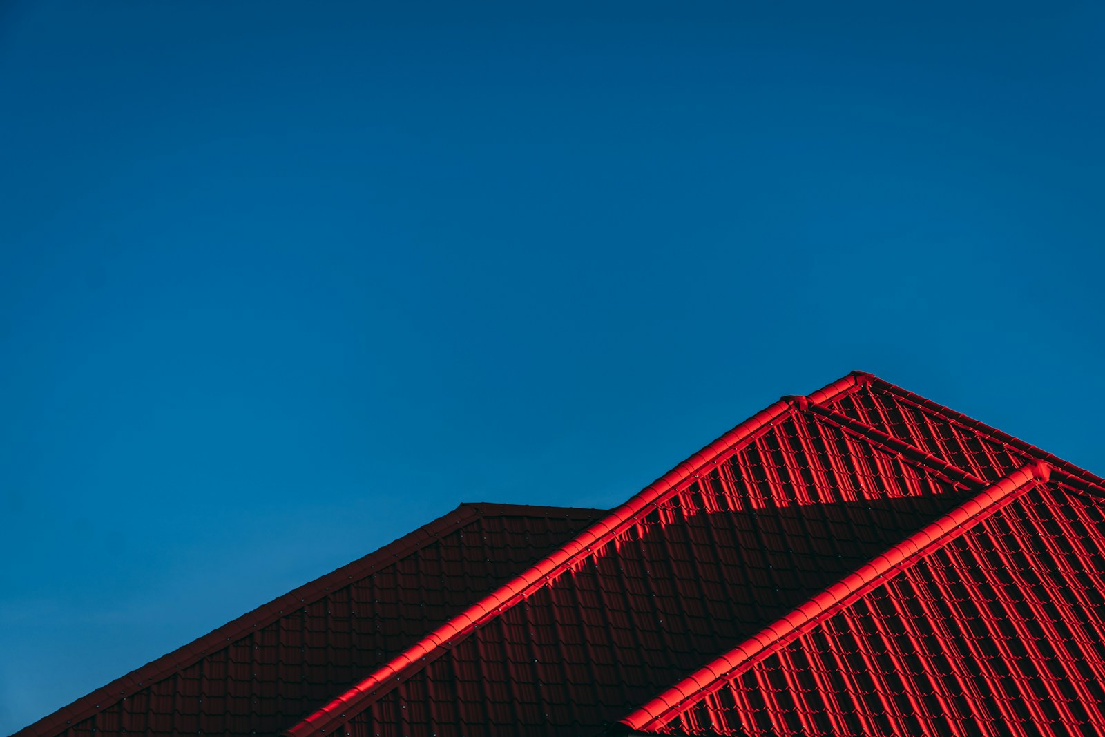 red and black building under blue sky