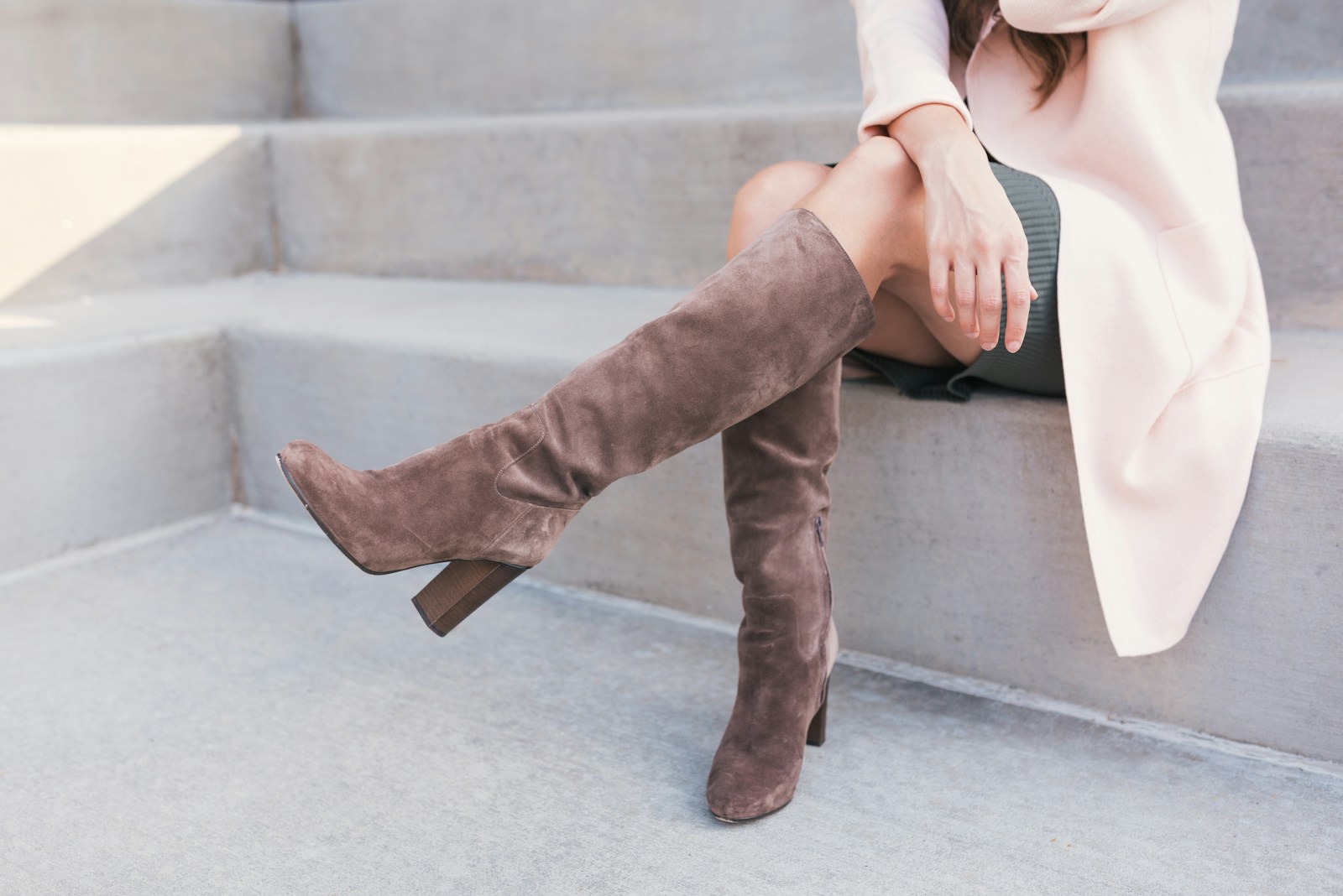 woman wearing pair of brown leather boots