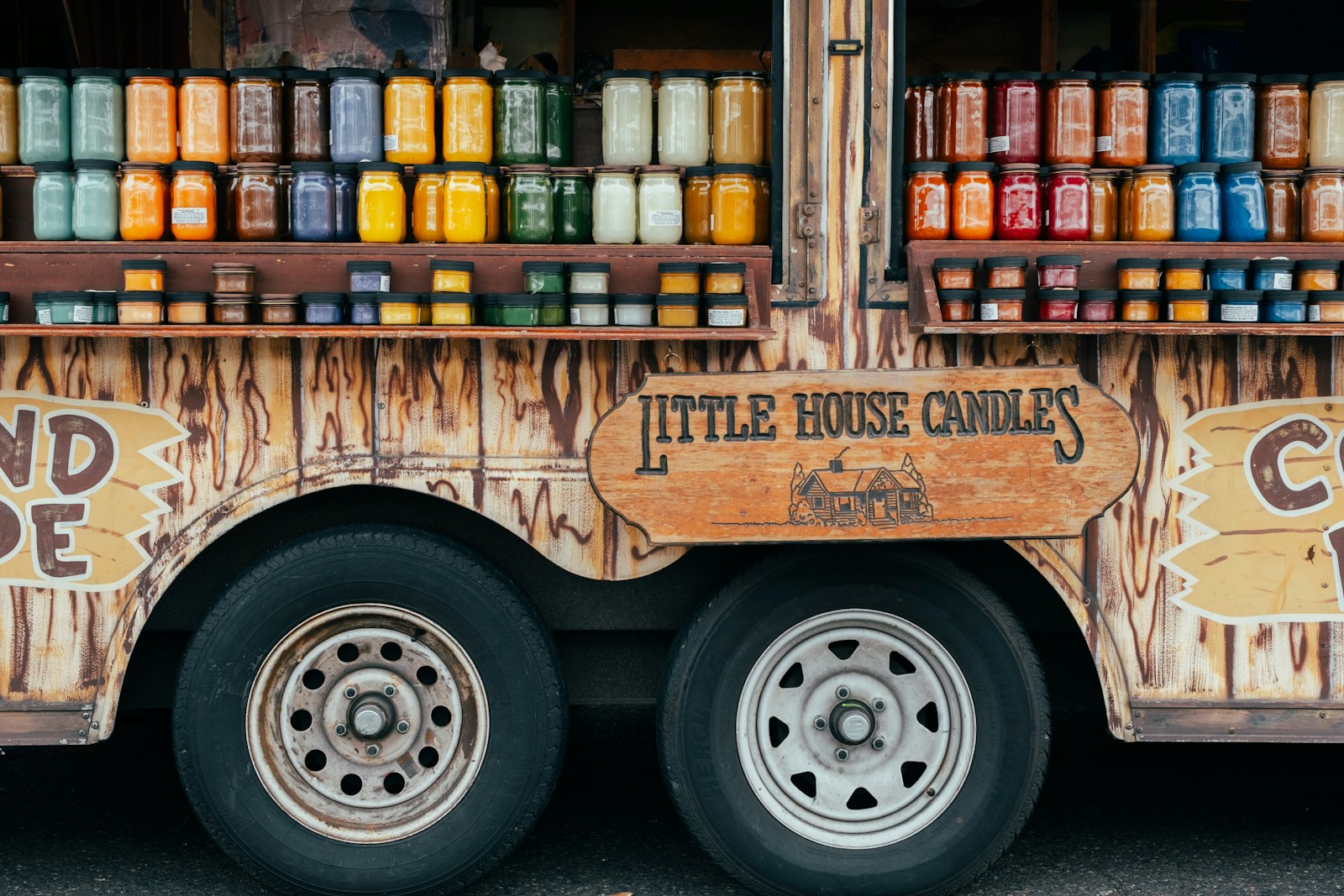 A truck that has some kind of food on the side of it